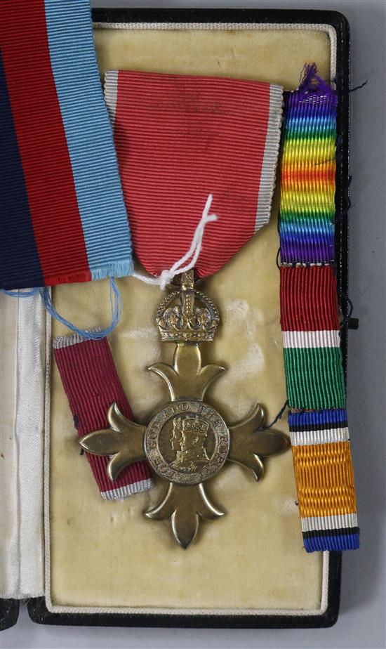 A cased O.B.E. medal